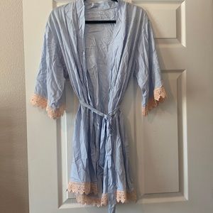 Light blue robe with tan lace on ends